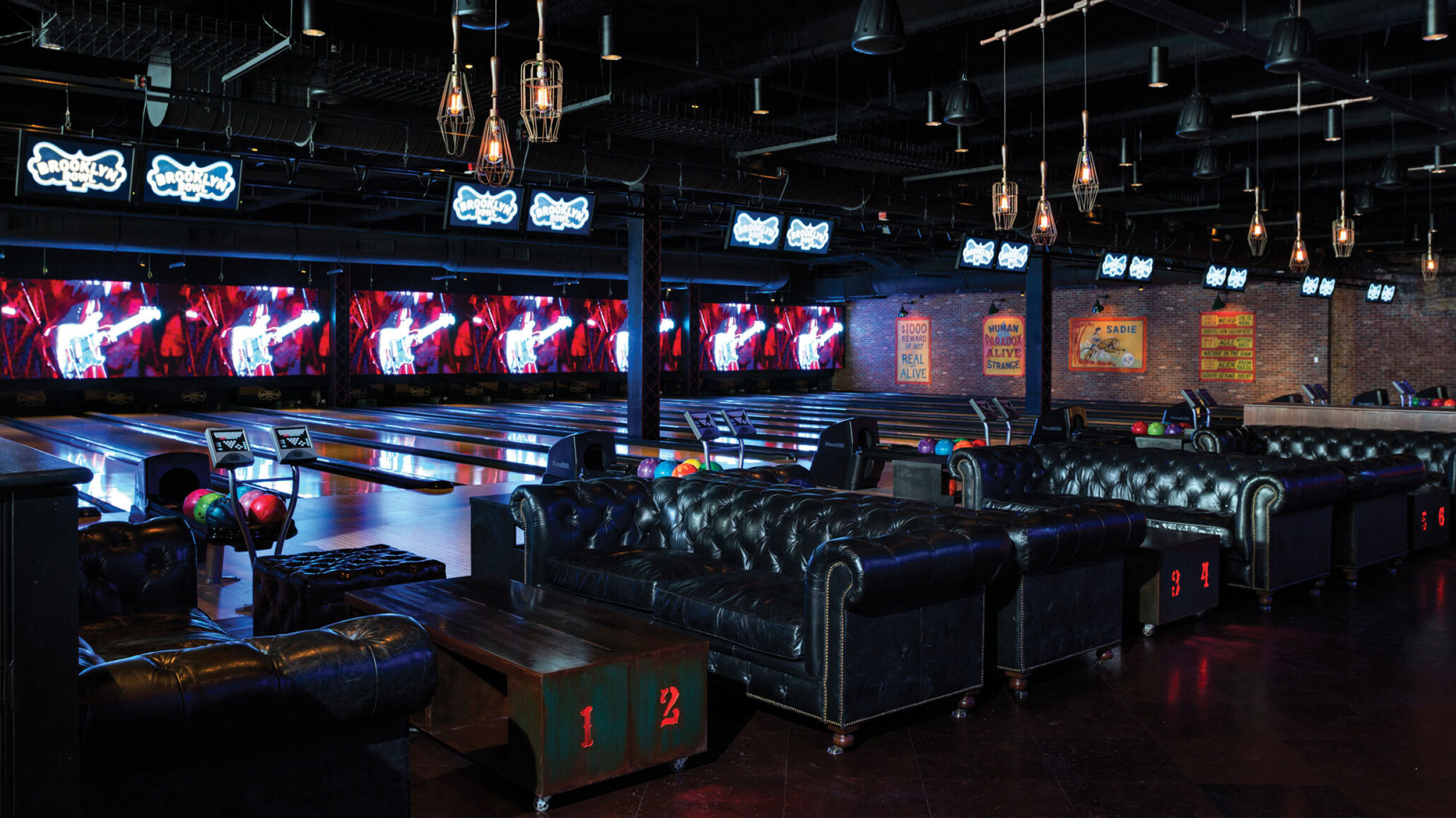 Leather lounge seating beside bowling lanes