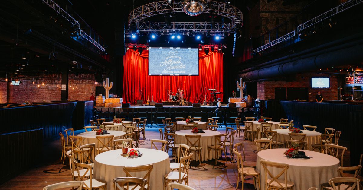 Round-table reception facing the stage